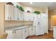 Spacious kitchen boasts ample cabinet space, sleek appliances, and a convenient breakfast bar at 1222 Camero Dr, The Villages, FL 32159
