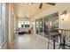 Inviting sunroom with large windows, providing a relaxing space to enjoy the outdoors from the comfort of indoors at 1222 Camero Dr, The Villages, FL 32159