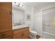 Full bathroom features a vanity sink, white toilet, and shower-tub with curtain at 1251 Saranac Pl, The Villages, FL 32163