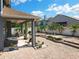 Outdoor patio with brick flooring and seating area offers an inviting space for relaxation and entertaining at 13519 Bristlecone Cir, Orlando, FL 32828