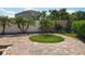 Well-maintained backyard with a brick patio offers a serene escape with privacy and charm at 13519 Bristlecone Cir, Orlando, FL 32828
