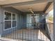 View of the outdoor balcony with sliding glass doors and a ceiling fan for a cool breeze at 13519 Bristlecone Cir, Orlando, FL 32828