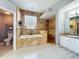 Stunning bathroom features a soaking tub, walk-in shower, and beautiful tile work at 13519 Bristlecone Cir, Orlando, FL 32828