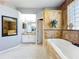 Modern bathroom with soaking tub, walk-in shower, and sleek vanity at 13519 Bristlecone Cir, Orlando, FL 32828