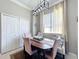 Dining room featuring contemporary lighting fixture, cushioned benches and direct access to other rooms at 13519 Bristlecone Cir, Orlando, FL 32828
