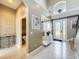 Inviting foyer with a view to a half bathroom and a decorative front door at 13519 Bristlecone Cir, Orlando, FL 32828
