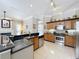 The eat-in kitchen opens to the spacious living room, perfect for entertaining friends and Gathering at 13519 Bristlecone Cir, Orlando, FL 32828