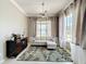 Comfortable living room featuring a patterned rug, stylish decor, and bright natural light at 13519 Bristlecone Cir, Orlando, FL 32828
