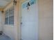Exterior shot of unit's front door with the unit number and a window at 1400 Eudora Rd # A08, Mount Dora, FL 32757