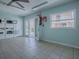 Light-filled laundry room with multiple machines, tiled flooring, and easy access to outside offers on-site laundry convenience at 1400 Eudora Rd # A08, Mount Dora, FL 32757