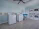 Clean, light-filled laundry room with multiple machines and tiled flooring offers convenient on-site laundry facilities at 1400 Eudora Rd # A08, Mount Dora, FL 32757