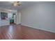 Living room with tile floors open to the kitchen and nearby doorway at 1400 Eudora Rd # A08, Mount Dora, FL 32757