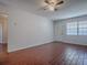 Open living space featuring tile flooring and neutral walls with natural lighting at 1400 Eudora Rd # A08, Mount Dora, FL 32757