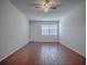 Living room with wood-look tile floors and a ceiling fan at 1400 Eudora Rd # A08, Mount Dora, FL 32757