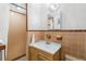 Bathroom with tiled shower and sink at 1406 Spartan Ave, Leesburg, FL 34748