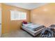 Small bedroom with a window and a single bed at 1406 Spartan Ave, Leesburg, FL 34748