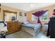 Bright bedroom featuring window and built-in wooden dresser at 1406 Spartan Ave, Leesburg, FL 34748