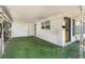 Attached carport offering covered parking, with doorway access to the home's interior at 1406 Spartan Ave, Leesburg, FL 34748