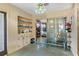 Cozy living room features built-in shelving and mirrored sliding glass doors at 1406 Spartan Ave, Leesburg, FL 34748