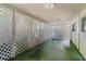 Covered patio with white latticework at 1406 Spartan Ave, Leesburg, FL 34748