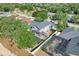 Aerial view of the home showing the screened pool and surrounding neighborhood at 14305 Pine Cone Trl, Clermont, FL 34711