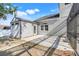 A cozy backyard patio features pavers and a shed, creating a relaxing outdoor retreat at 14305 Pine Cone Trl, Clermont, FL 34711