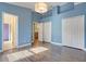 Large bedroom with high ceilings, wood-look floors, and ample closet space at 14305 Pine Cone Trl, Clermont, FL 34711
