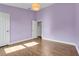 Spacious bedroom features wood-look floors, fresh paint, and natural light at 14305 Pine Cone Trl, Clermont, FL 34711