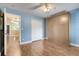 Bedroom features a Murphy bed, wood-look floors, and a double closet at 14305 Pine Cone Trl, Clermont, FL 34711
