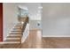 Welcoming entryway with hardwood floors, staircase with iron railing, and neutral wall color at 14305 Pine Cone Trl, Clermont, FL 34711