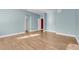Spacious living room featuring hardwood floors and abundant natural light at 14305 Pine Cone Trl, Clermont, FL 34711