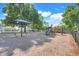 Community playground with swings, slides, and a shaded picnic area for residents at 14305 Pine Cone Trl, Clermont, FL 34711