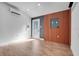 The room features a modern design with wood accents, sleek lighting, and a contemporary aesthetic at 14305 Pine Cone Trl, Clermont, FL 34711