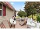 Relaxing patio with outdoor seating, brick flooring, and white picket fence at 1526 Blueberry Way, The Villages, FL 32162