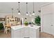 Spacious kitchen island overlooking the dining and living areas, with bright lighting and modern features at 1526 Blueberry Way, The Villages, FL 32162