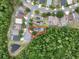 Aerial shot shows the home's location in a cul-de-sac with a screened pool and solar panels at 156 Ridgebrook Ct, Davenport, FL 33896