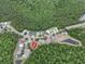 Aerial view highlighting the house's location within the neighborhood, surrounded by lush greenery at 156 Ridgebrook Ct, Davenport, FL 33896