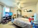 Cluttered bedroom with a ceiling fan and a television at 156 Ridgebrook Ct, Davenport, FL 33896