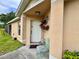 Close up on an inviting front entrance with decorative floral arrangement at 156 Ridgebrook Ct, Davenport, FL 33896