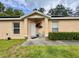 Inviting front porch with decorative plants and seating, perfect for relaxation at 156 Ridgebrook Ct, Davenport, FL 33896