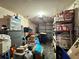 A cluttered garage filled with storage boxes and bins at 156 Ridgebrook Ct, Davenport, FL 33896