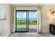 Bedroom with sliding glass door to a deck and a beautiful view of the water at 16047 E Shirley Shores Rd, Tavares, FL 32778