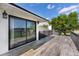 Outdoor deck with black railing and large glass door leading to the interior at 16047 E Shirley Shores Rd, Tavares, FL 32778