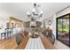 Bright dining room flows into open floorplan with kitchen and living room at 16047 E Shirley Shores Rd, Tavares, FL 32778