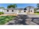 Beautifully renovated home with a new roof, landscaping, and a welcoming circular driveway at 16047 E Shirley Shores Rd, Tavares, FL 32778