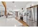 Modern kitchen with stainless steel appliances and island with a sink at 16047 E Shirley Shores Rd, Tavares, FL 32778