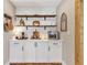 Butler's pantry with open shelving and modern decor at 16047 E Shirley Shores Rd, Tavares, FL 32778