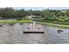 Aerial view of community dock in the water with a beautiful lake view at 16300 County Road 455 # 511, Montverde, FL 34756