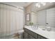Well-lit bathroom features a large mirror and a sink at 16300 County Road 455 # 511, Montverde, FL 34756