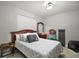 Simple bedroom with a bed, dresser, and nightstand at 16300 County Road 455 # 511, Montverde, FL 34756